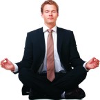 Businessman sitting in lotus position, Isolated against white background